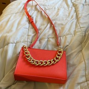 Pop orange purse with faux gold chain detail